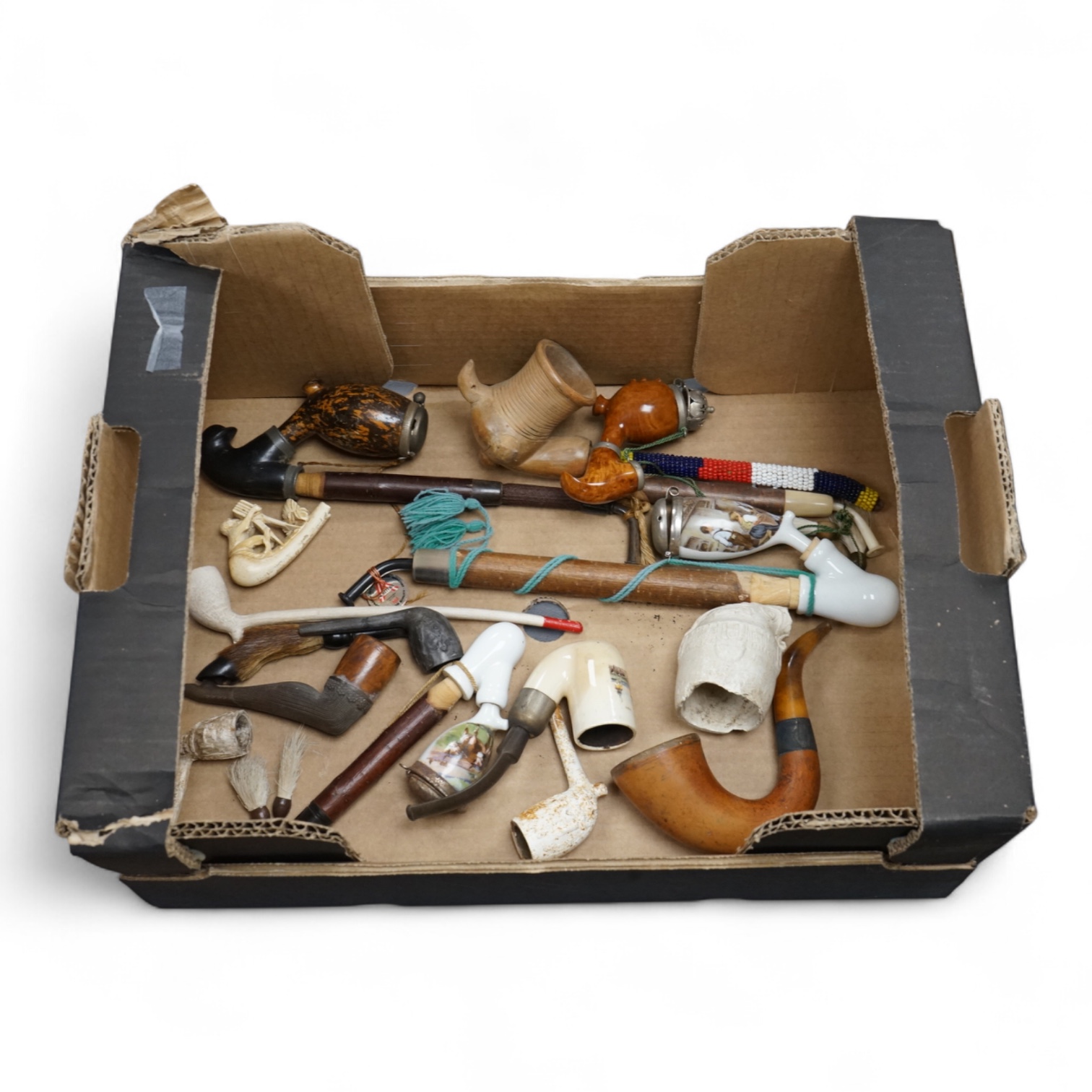 A group of fifteen novelty pipes to include treen, clay and ceramic examples